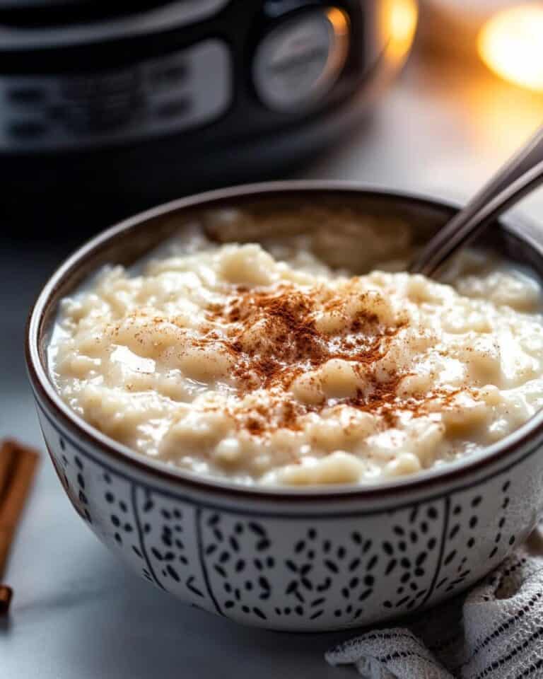 Creamy mac and cheese in a patterned bowl, perfect for freezer-to-air-fryer comfort.